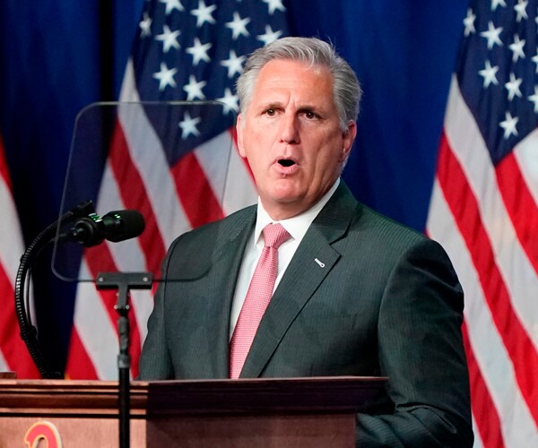kevin mccarthy speaks at a lectern