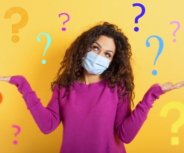 a woman with a mask on and lots of question marks around her