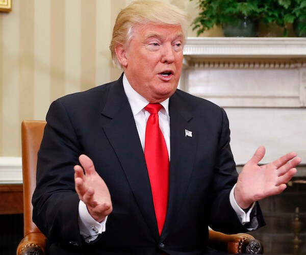 president donald trump gestures as he speaks in the oval office