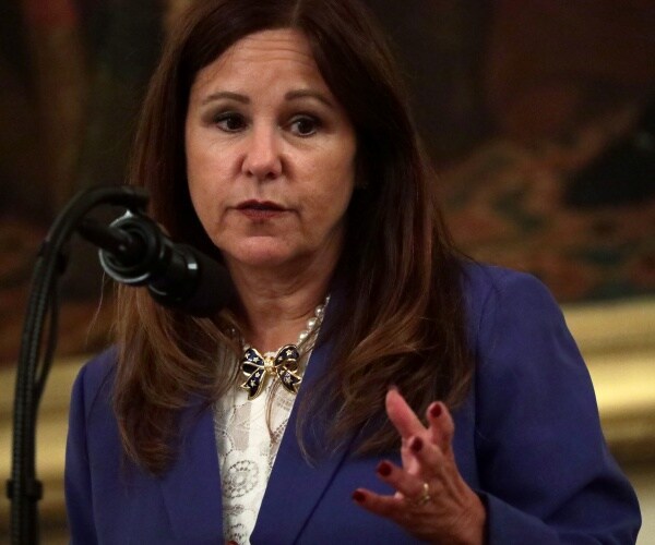 karen pence in a blue blazer and white blouse