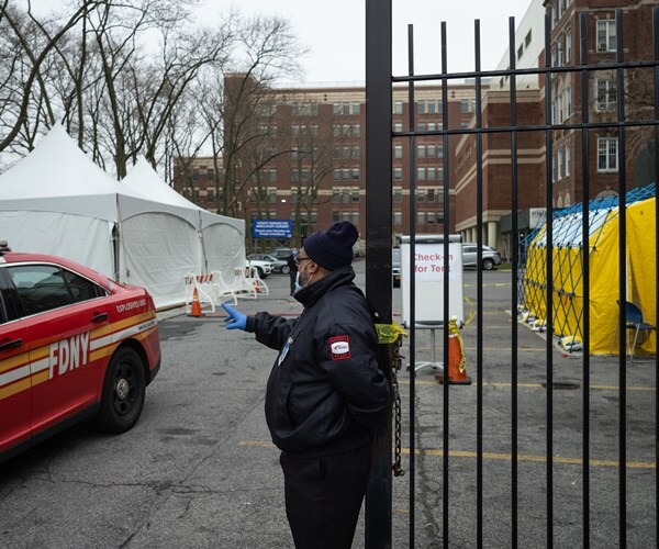 a hospital has tents for the overflow of patiends