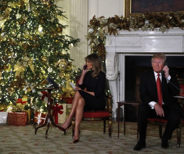 donald trump and melania trump take calls about santa claus' whereabouts. 