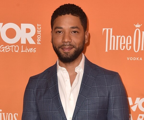 jussie smollett poses for camera