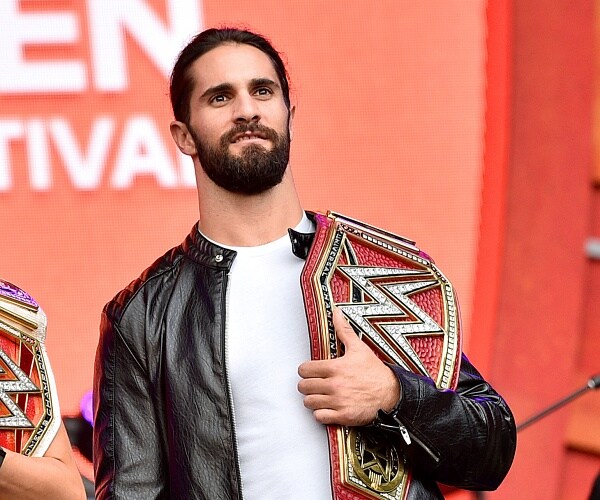 seth rollins stands onstage in central park