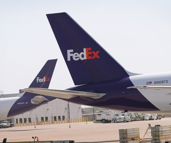 fedex jets sit outside at chicago's o'hare airport