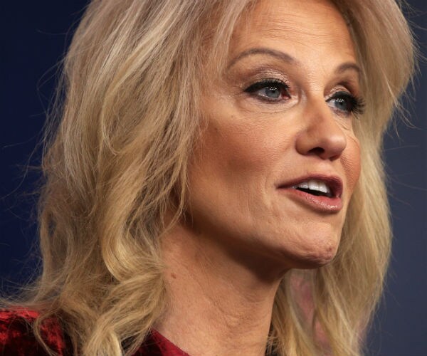 kellyanne conway is shown in a red velvet dress