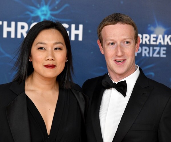 priscilla chan and mark zuckerberg post for a