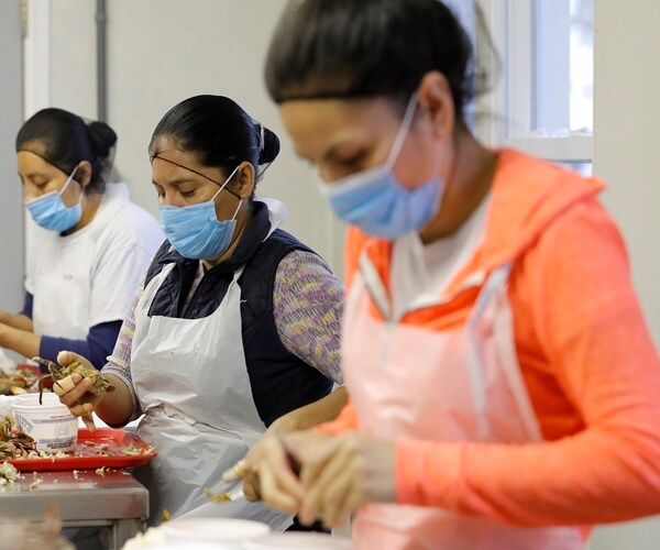 US Workers Faced Harrowing Year on Pandemic Front Lines