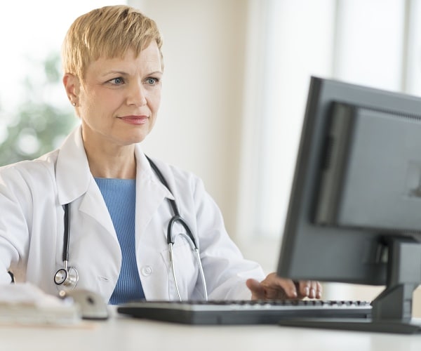 doctor working on computer
