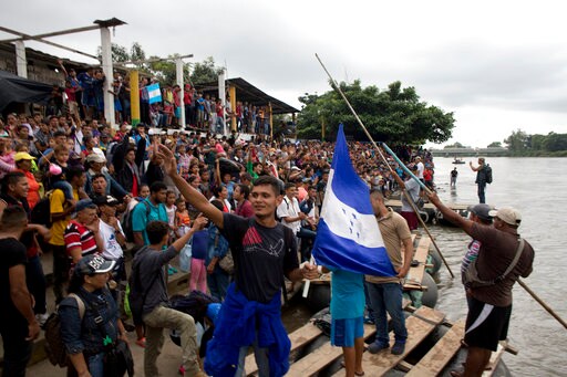 The Latest: Migrants Prepare to cross into Mexico Territory