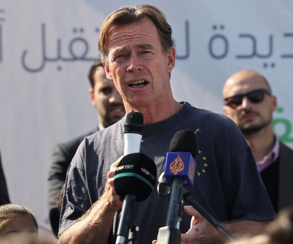 a man speaks into a microphone