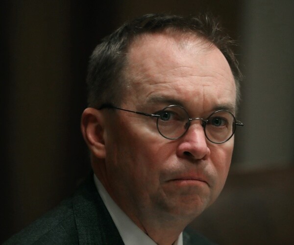 mick mulvaney sits in oval office