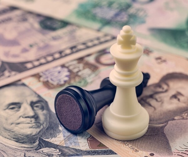 black loser and white winner chess king on US dollar and china yuan banknotes, world major market countries. 