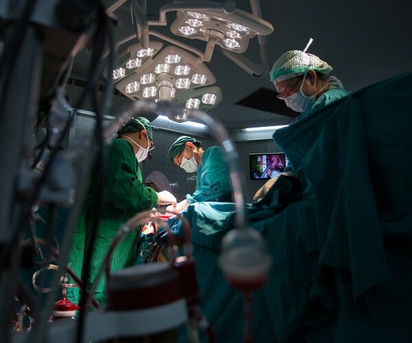 doctors performing surgery