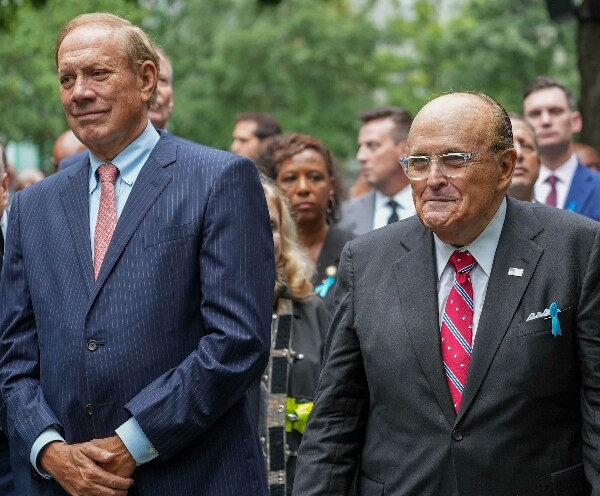 George Pataki and Rudy Giuliani stand at the 9/11 Memorial