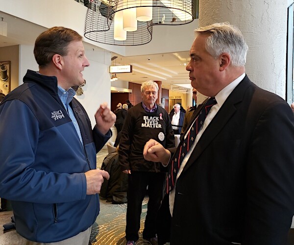 John Gizzi interviews New Hampshire Republican Gov. Chris Sununu (left) on day of the New Hampshire primary