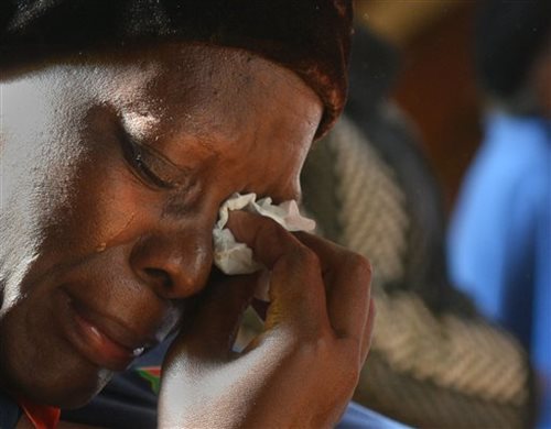 Worshipper Weeps During Prayer for Mandela