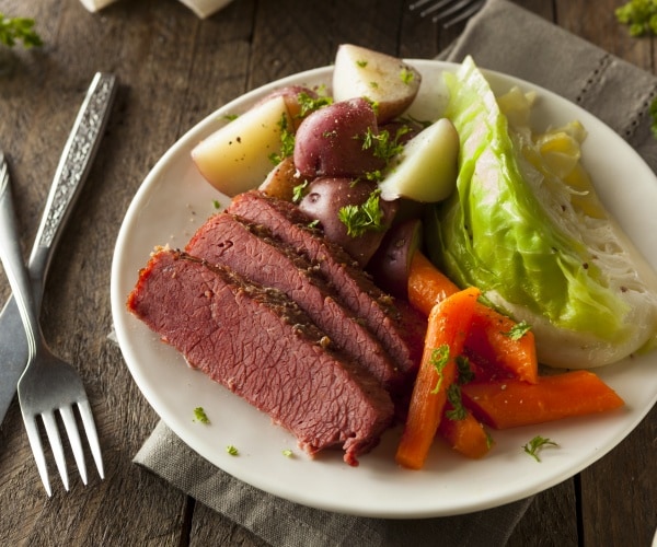 corned beef and cabbage and carrots on plate
