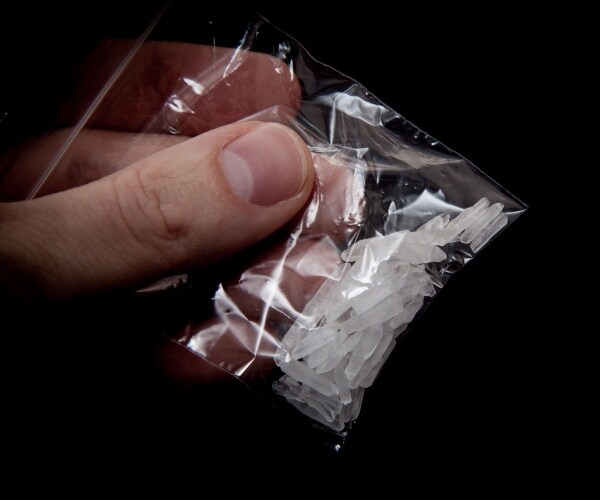 crystal meth is shown in a small plastic bag