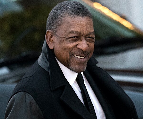 robert johnson looks over and smiles while captured on by photographer