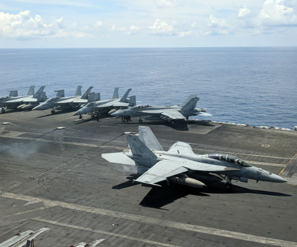 us navy super hornets multirole fighter landing on the flight deck of uss ronald reagan  