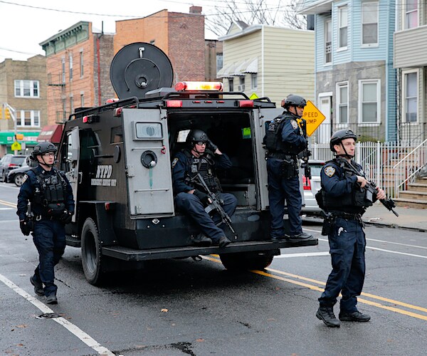 a new jersey special weapons and tactical unit gets out of an armored vehicle during a mass shooting event