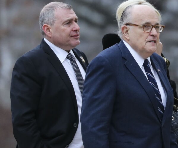 Rudy Giuliani, center, and Soviet-born businessman Lev Parnas, left are shown.