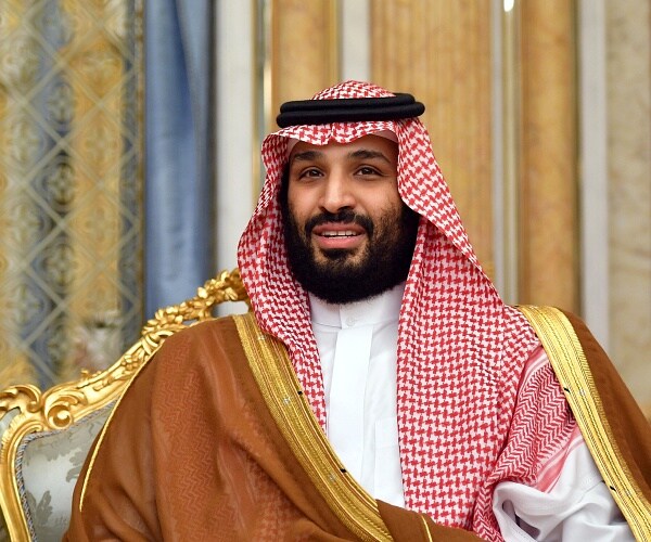 mohammed bin salman sits in chair