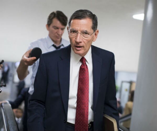 john barrasso is shown doing an interview