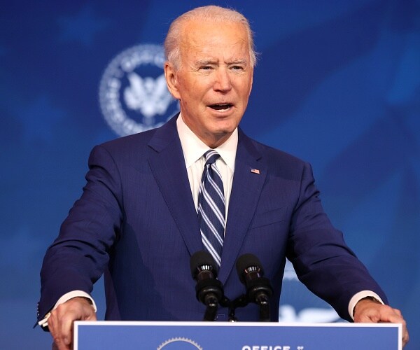 joe biden speaks from behind podium