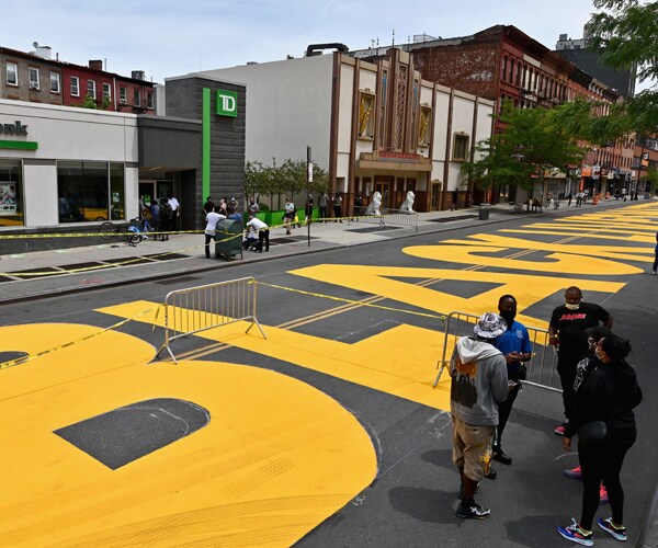 a black lives matter street mural in brooklyn