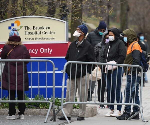 black americans wait in line outside a brooklyn hospital to be tested for covid