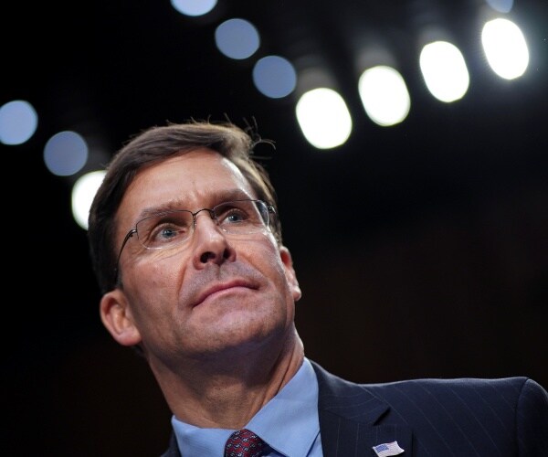 mark esper wearing a light blue shirt is pictured