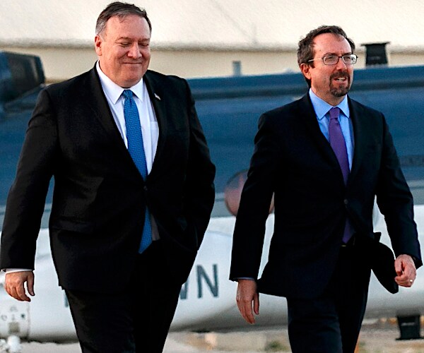 Secretary of State Mike Pompeo and Amb. John Bass walk on the tarmac in afghanistan