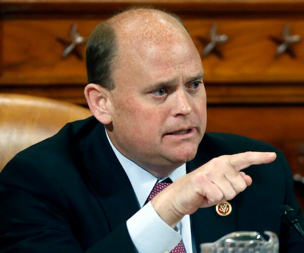new york republican representative tom reed points with his right index finger during a house session