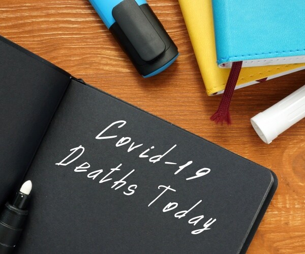 notebook with heading COVID-19 Deaths Today