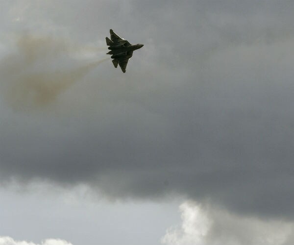 an aircraft is shown flying through the clouds