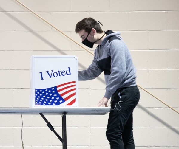 man uses voting machine