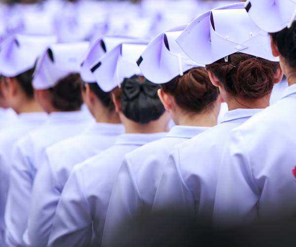 nursing school graduates in traditional garb