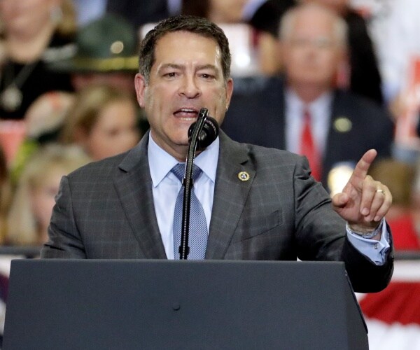 mark green speaks at podium