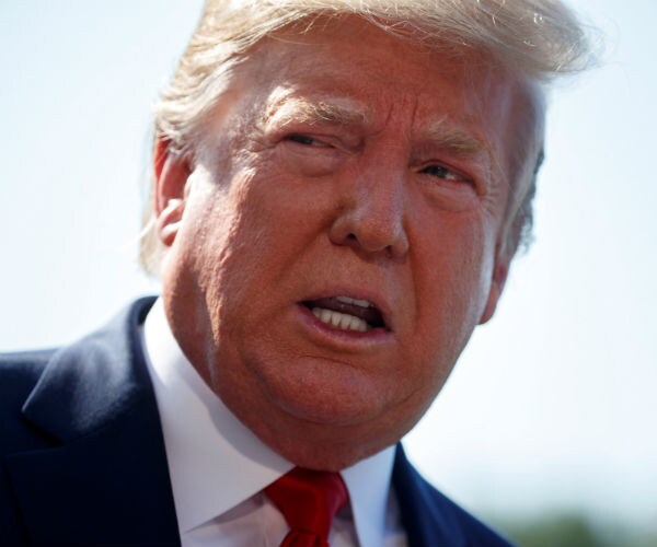 us president donald trump talks with reporters before departing for an event