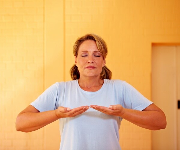 woman doing a breathing exercise