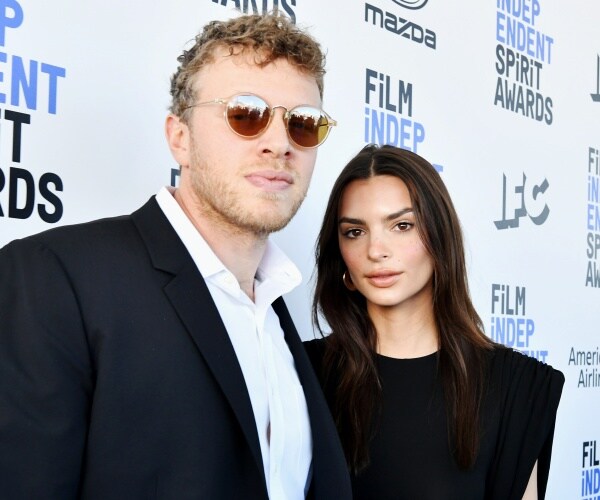 sebastian bear mcclard and emilty ratajkowski pose for camera