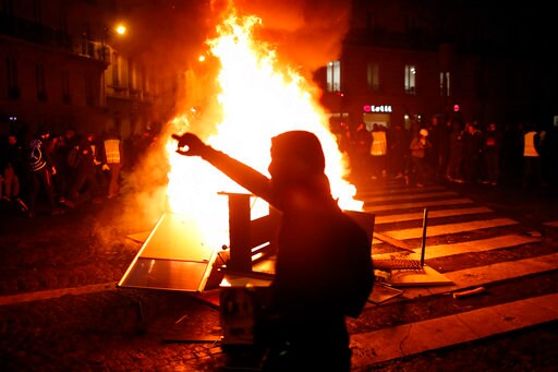 Paris Cleans up after Latest Riot; Pressure Builds on Macron