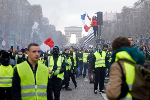 The Latest: Survey Shows French Protests Knocked Business