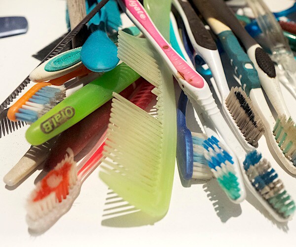 a pile of old combs and toothbrushes look dirty at a migrant detention center on the southern border