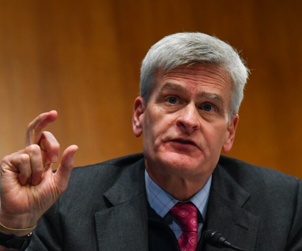 bill cassidy points and speaks during a senate committee hearing