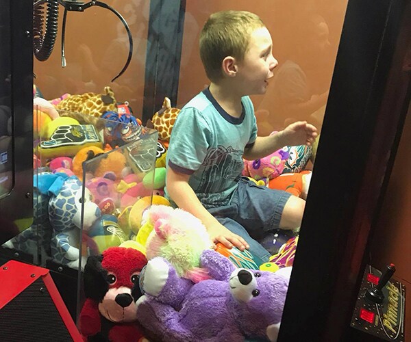 Boy Stuck Inside Arcade Machine Claw Game Rescued