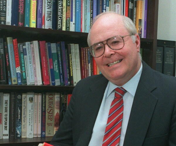 bill donohue in front of book shelves