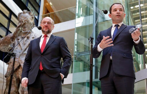 The Latest: French Socialist Candidate Meets Merkel, Schulz